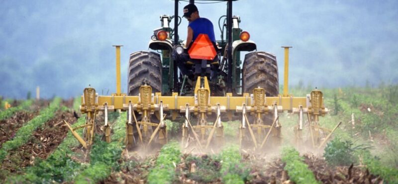 farmer-on-tractor-working farmer-on-tractor-working